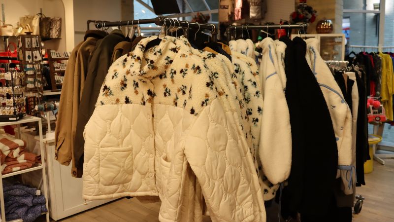 White jacket with floral detailing on the shoulders at The Forks Trading Company.